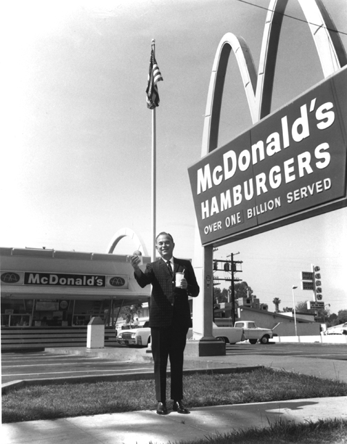 Ray Kroc outside an early McDonald's restaurant